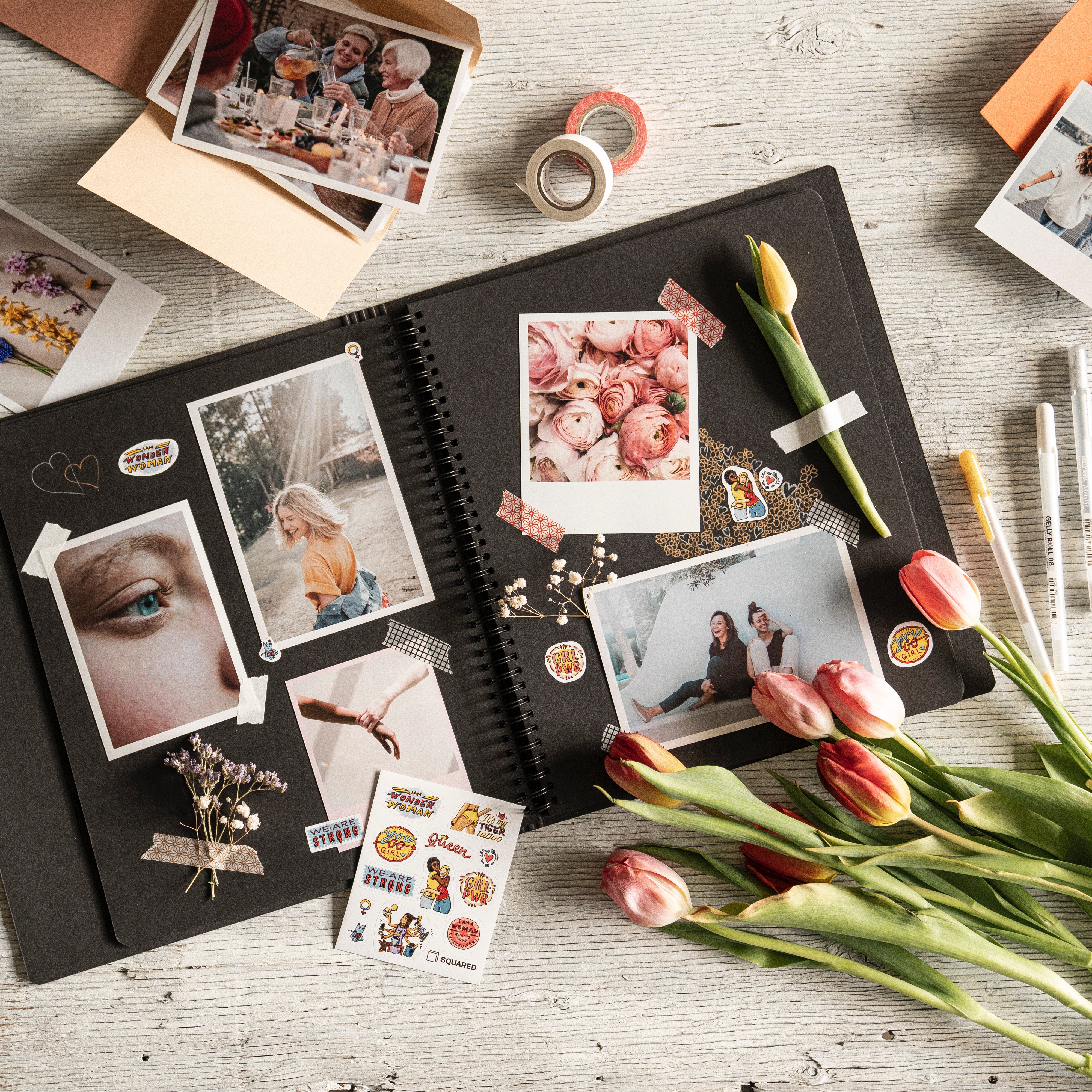 A scrapbook with an assortment of photographs and memorabilia.