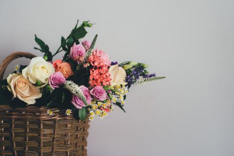 A basket filled with fresh-cut garden flowers.