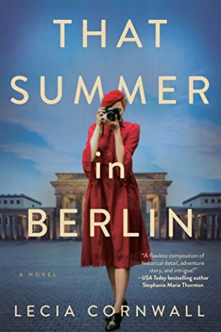 Book cover for "That Summer in Berlin" by Lecia Cornwall.  A woman in a red dress and hat is looking through the lens of a 1930s era camera.